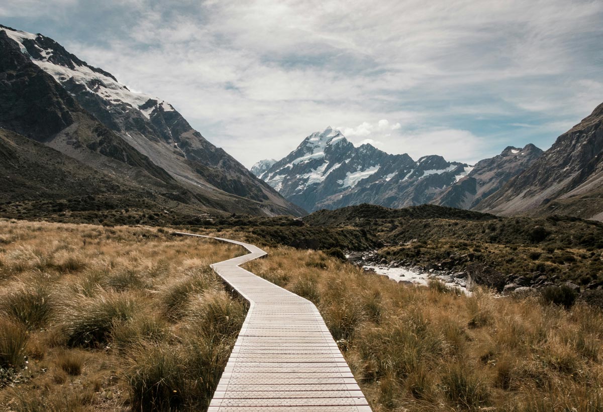 raised path in a valley leading into the mountaines