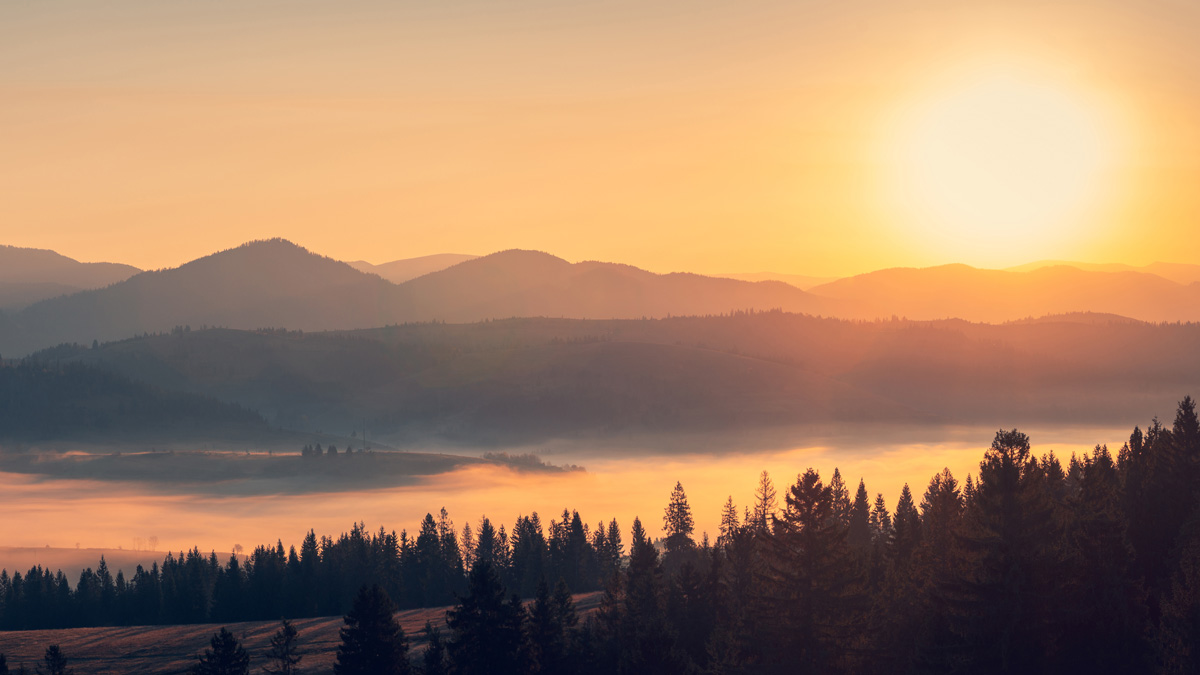 sunrise over the mountains and lake